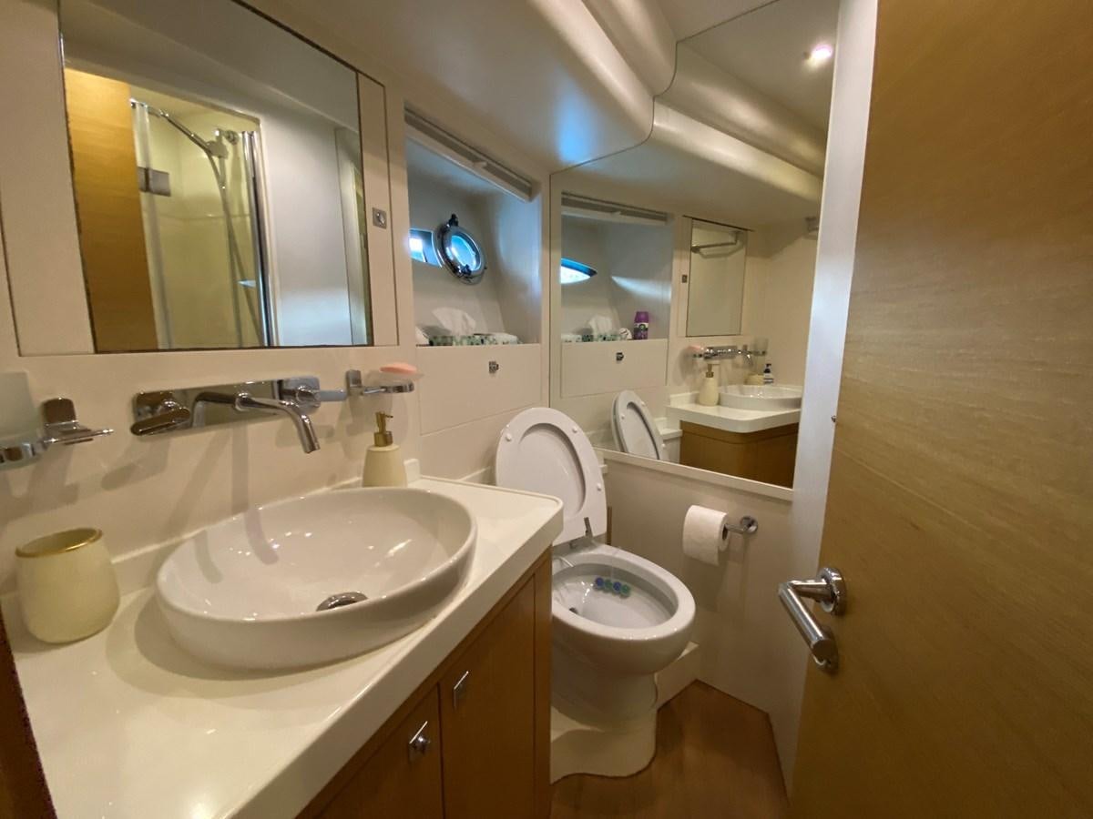 a bathroom with a toilet and a sink aboard MR CORN Yacht for Sale