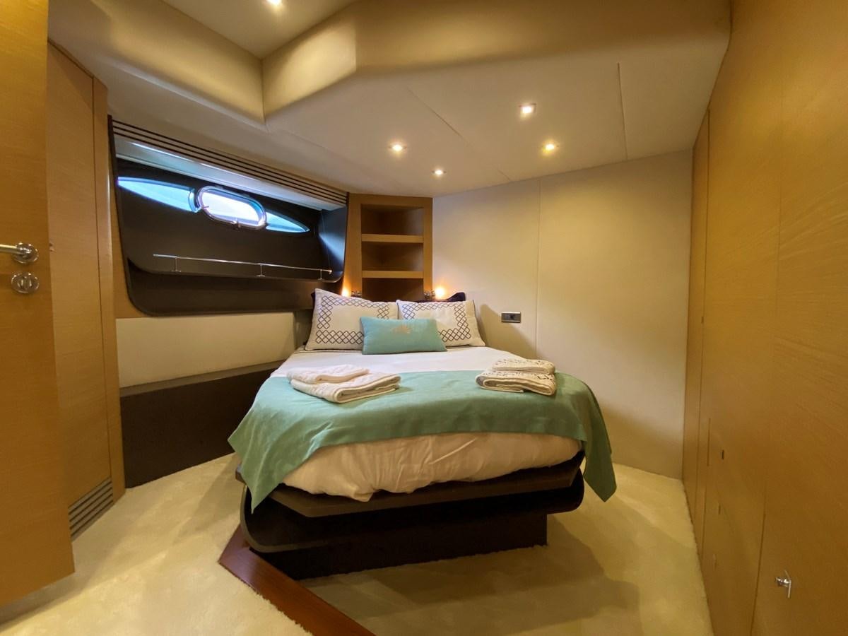 a bed in a room aboard MR CORN Yacht for Sale
