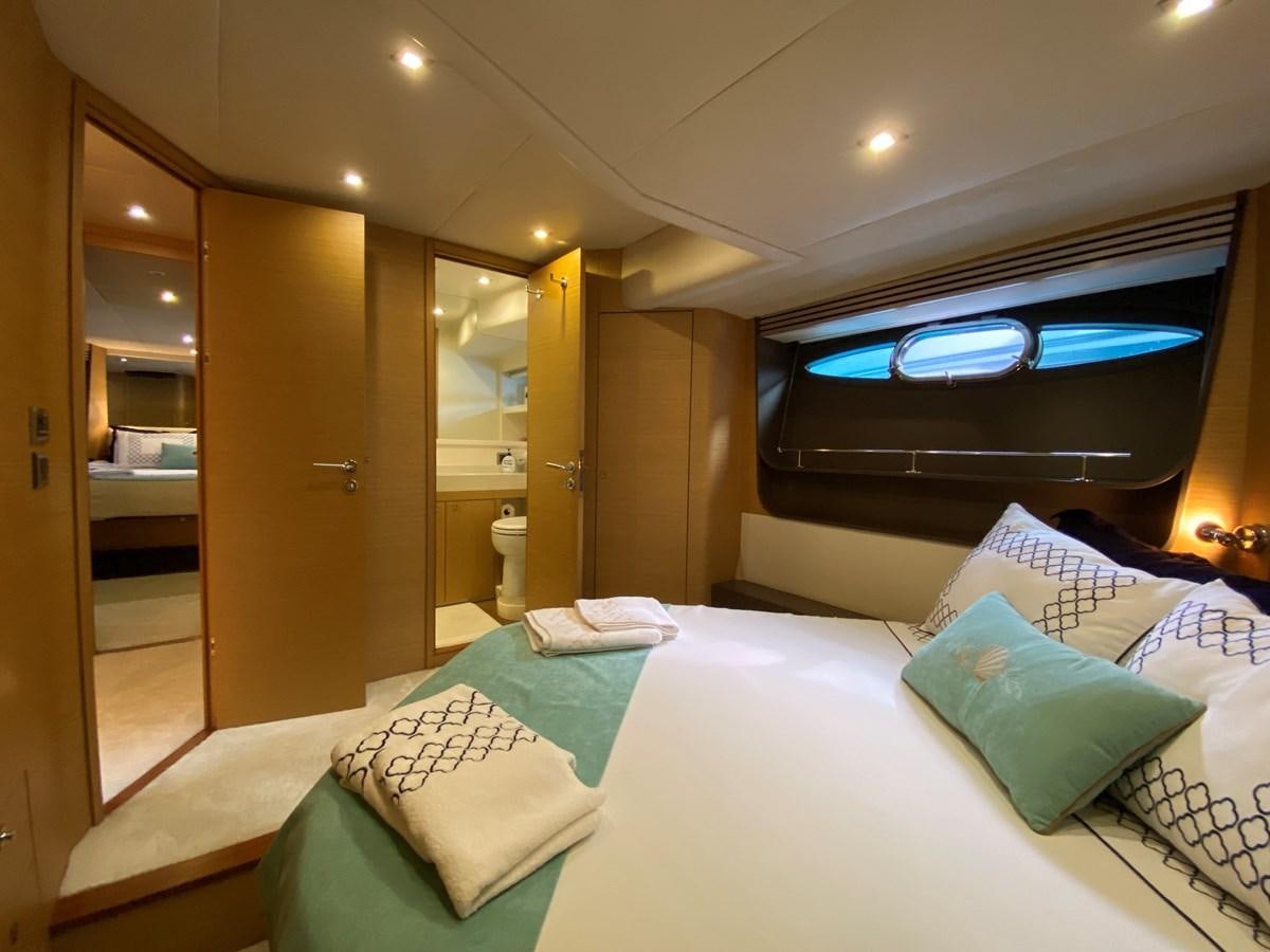 a hotel room with a bed aboard MR CORN Yacht for Sale