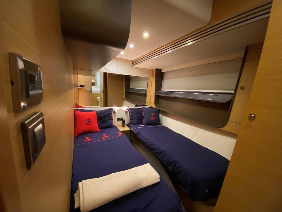 a room with bunk beds aboard MR CORN Yacht for Sale