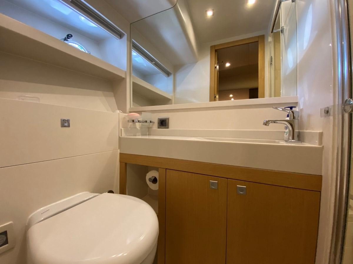 a bathroom with a sink and a toilet aboard MR CORN Yacht for Sale