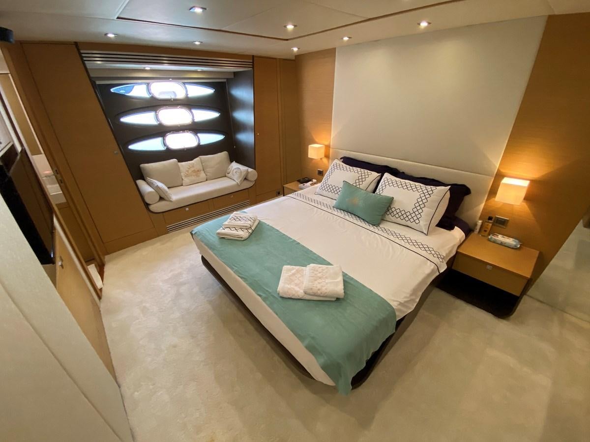 a hotel room with a bed and a desk aboard MR CORN Yacht for Sale
