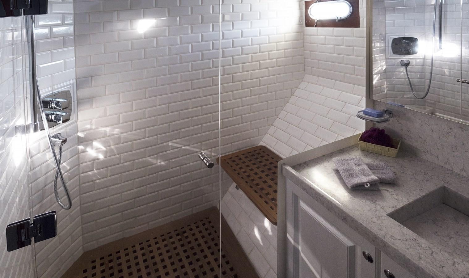 a bathroom with a sink and a shower aboard LADY FLORE Yacht for Sale
