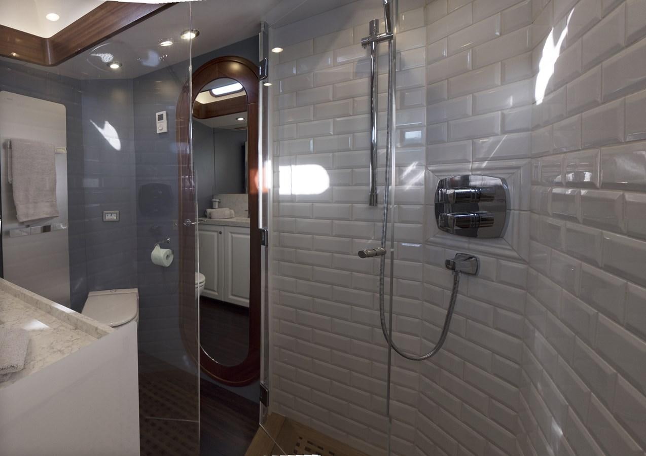 a bathroom with a glass shower aboard LADY FLORE Yacht for Sale