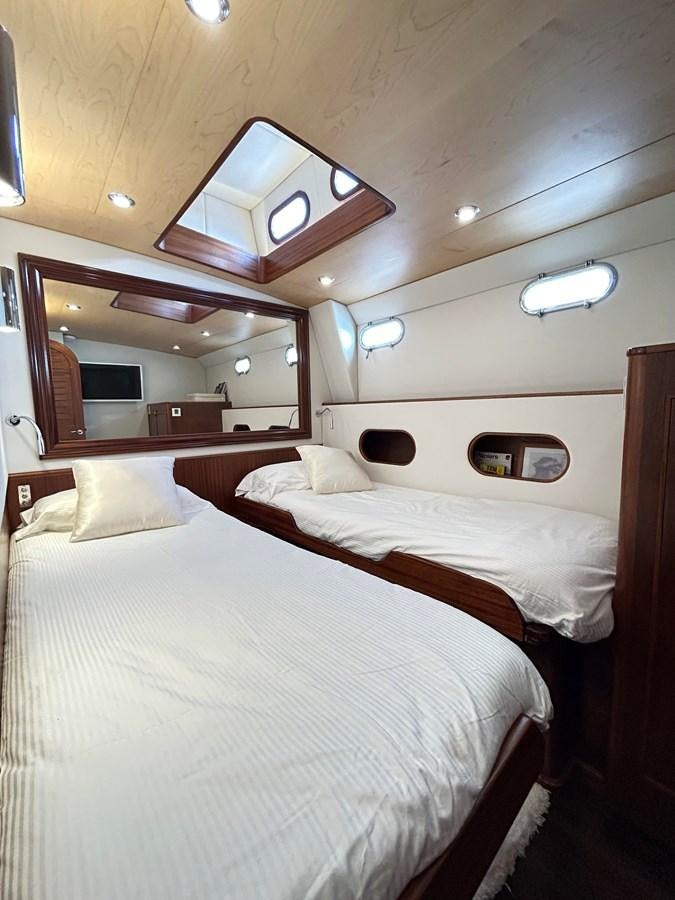 a room with two beds aboard LADY FLORE Yacht for Sale