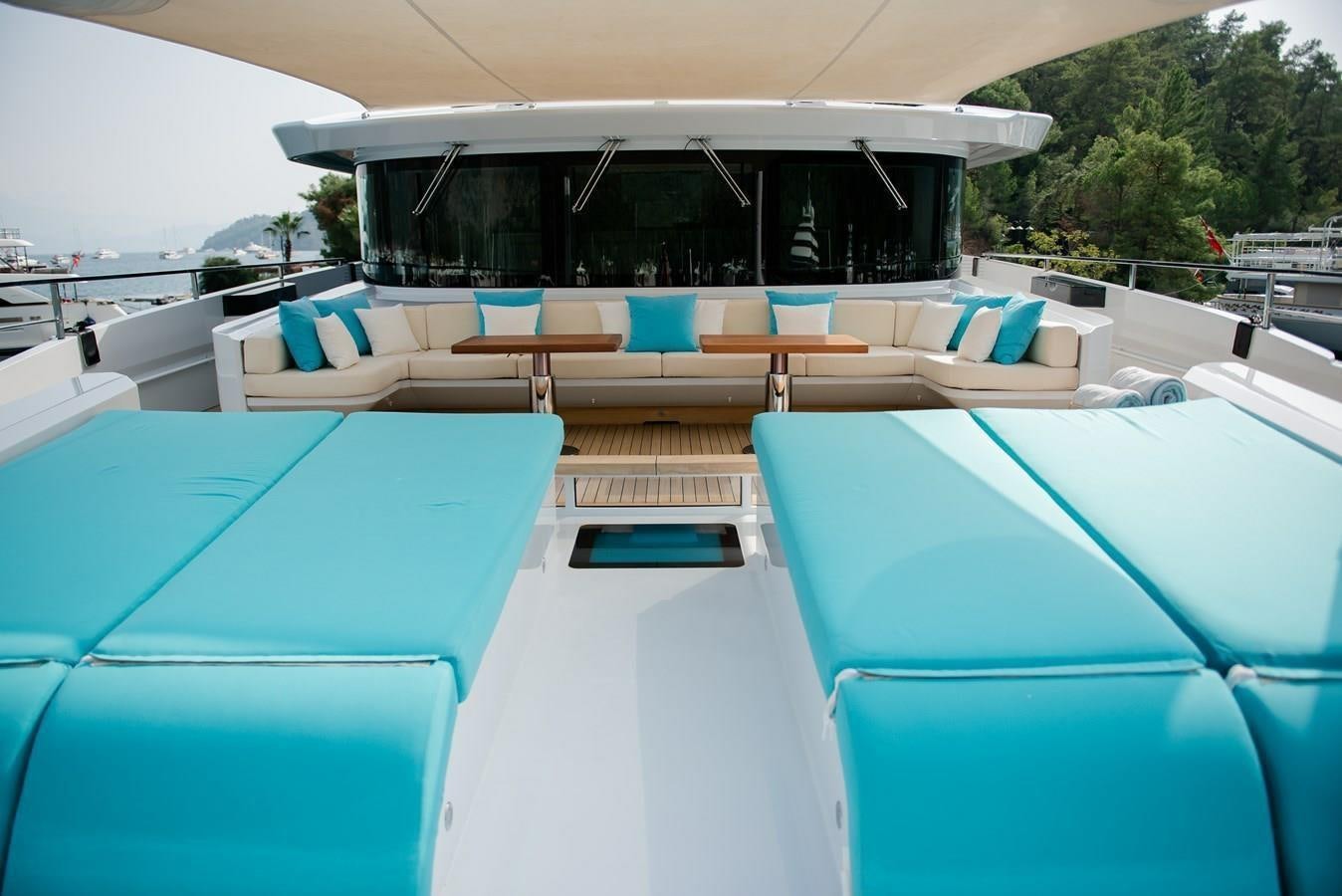 a pool with lounge chairs aboard SUNNY Yacht for Sale