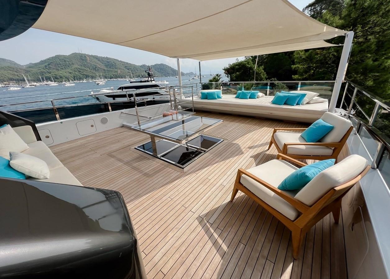 a deck with a chair and a pool aboard SUNNY Yacht for Sale