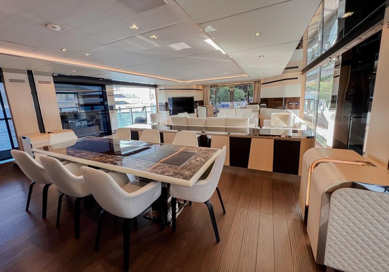 a room with tables and chairs aboard SUNNY Yacht for Sale