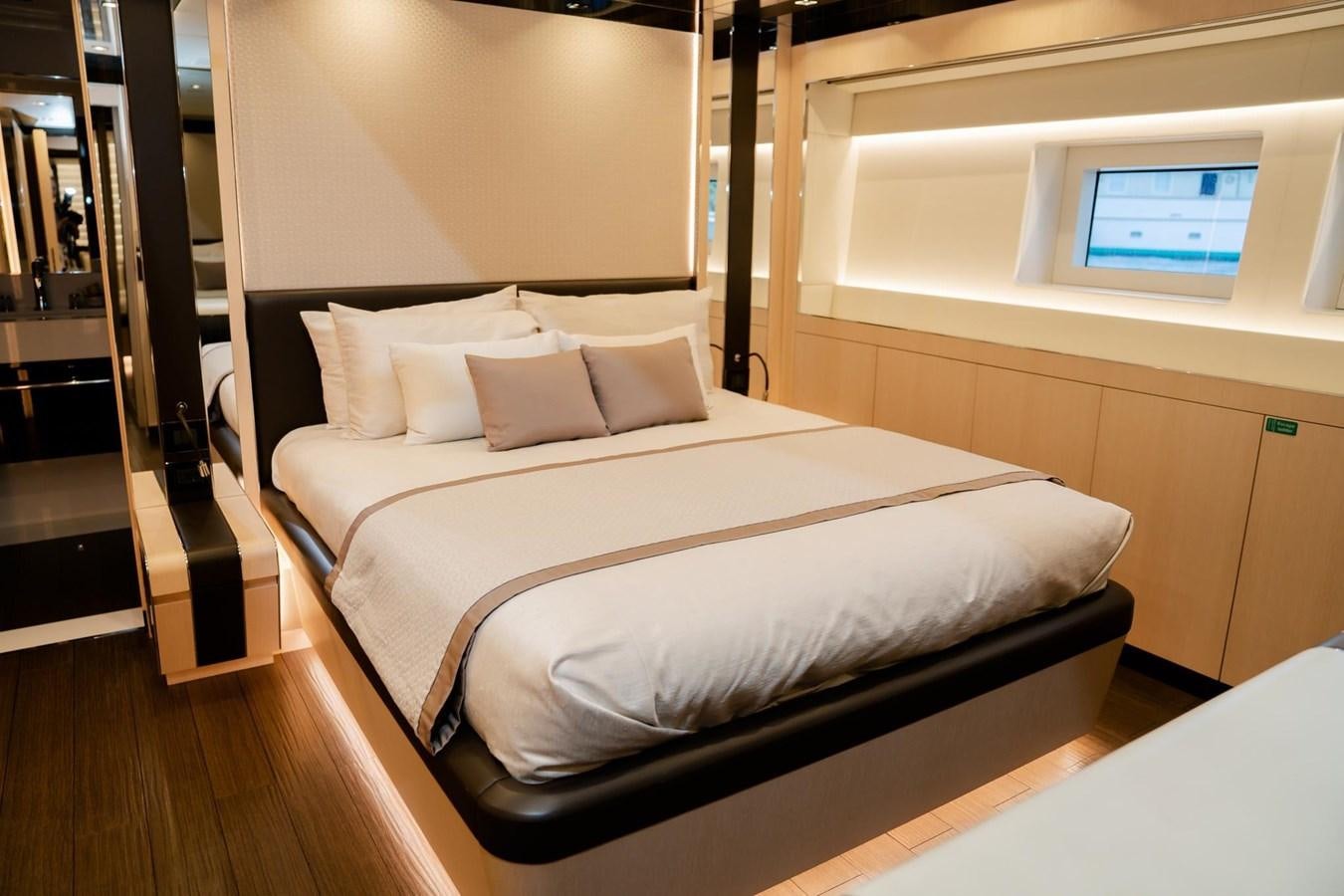 a bed with white sheets aboard SUNNY Yacht for Sale