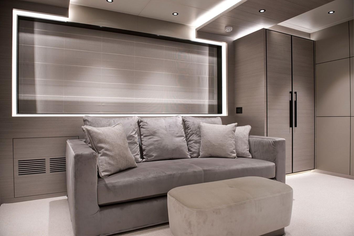 a couch in a room aboard PICCOLO @ FLIBS Yacht for Sale