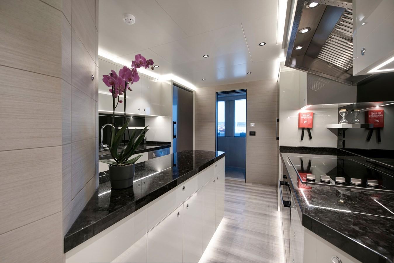 a kitchen with a countertop aboard PICCOLO @ FLIBS Yacht for Sale