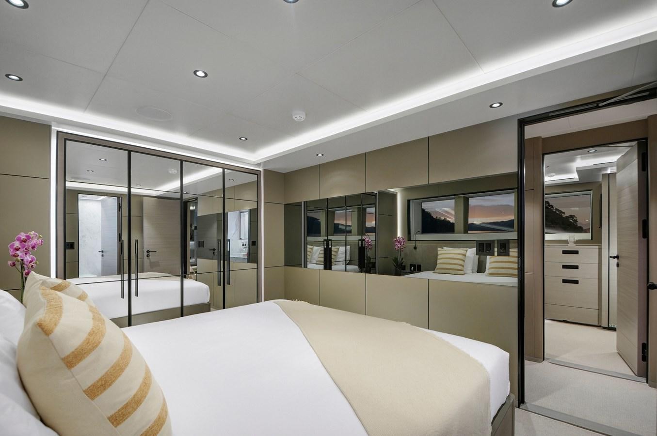 a large white bed in a room aboard PICCOLO @ FLIBS Yacht for Sale