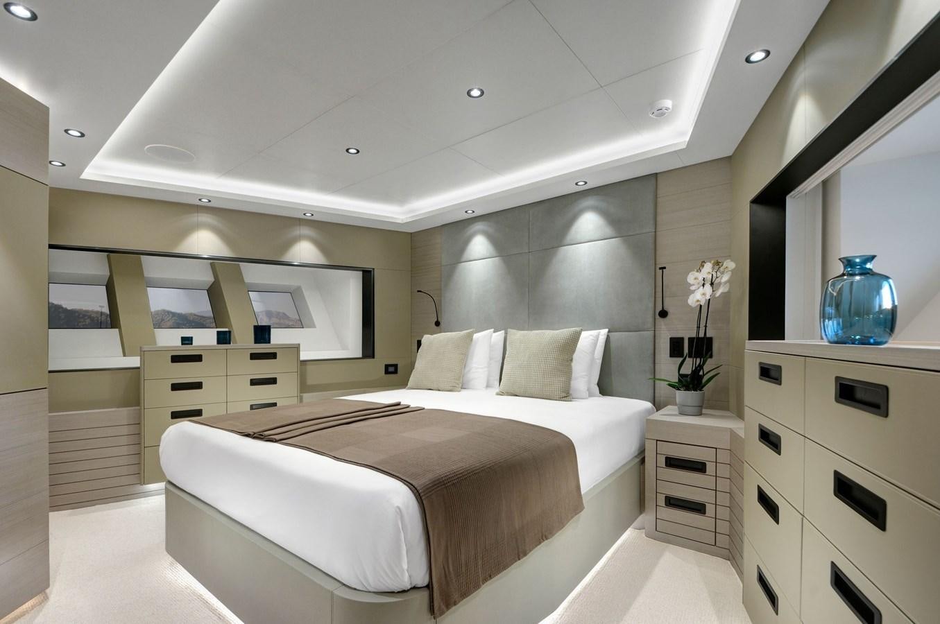 a bedroom with a large bed aboard PICCOLO @ FLIBS Yacht for Sale