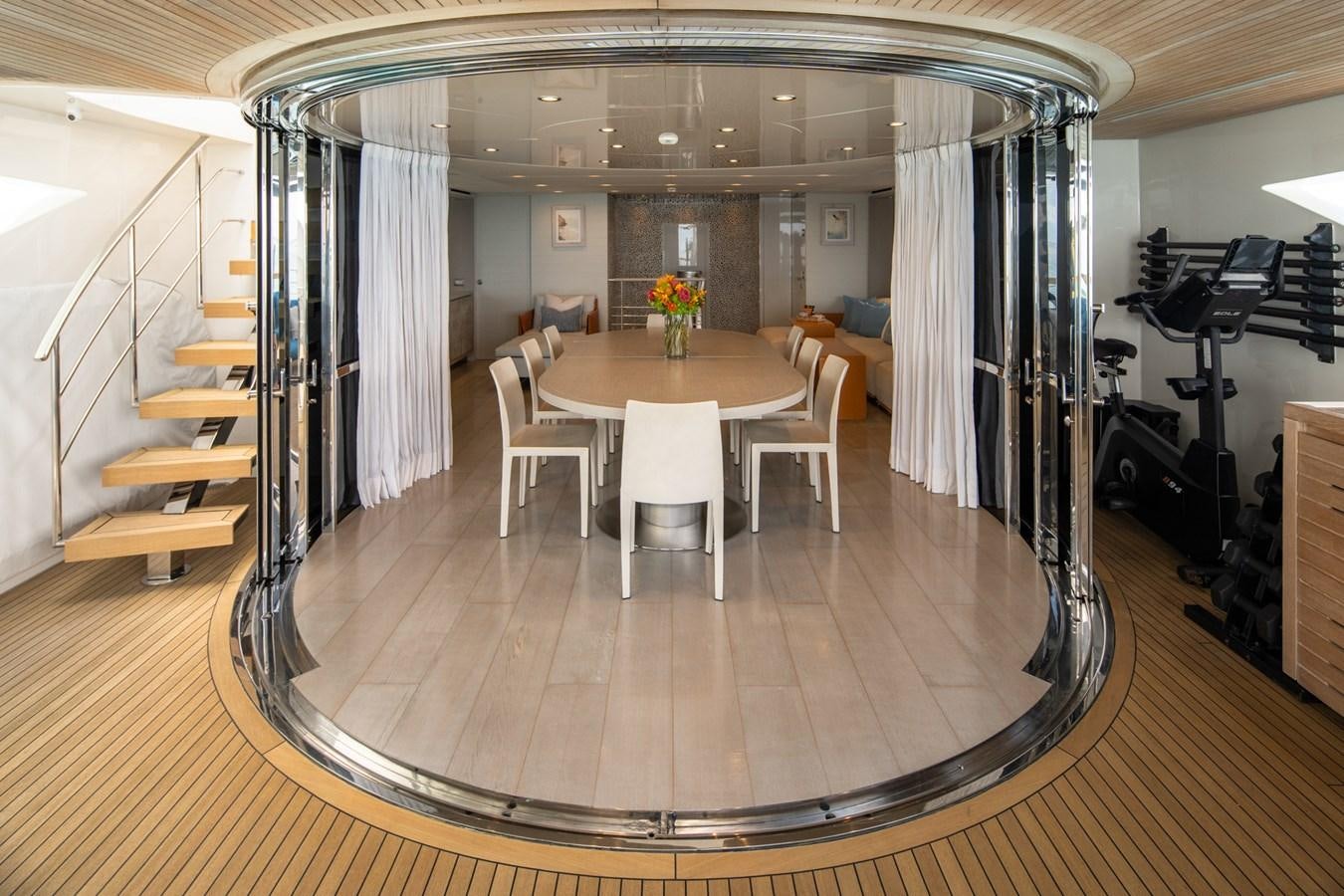 a room with a table and chairs aboard HALCYON Yacht for Sale