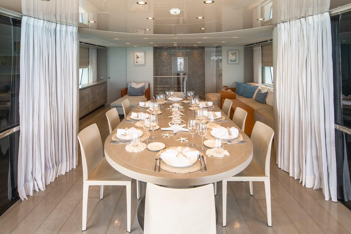 a dining table in a room aboard HALCYON Yacht for Sale