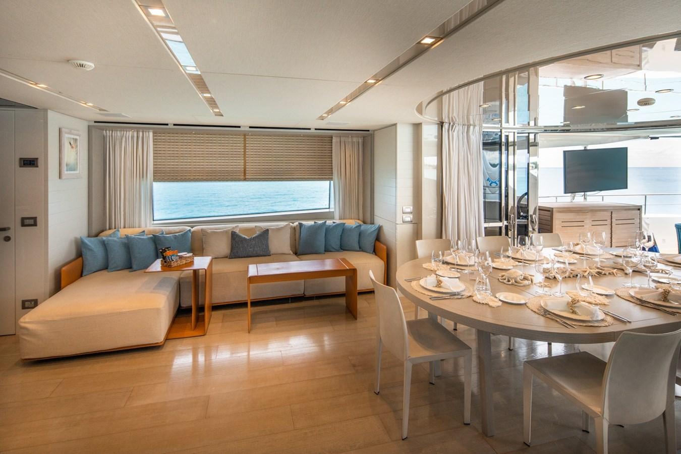 a living room with a couch and a table aboard HALCYON Yacht for Sale