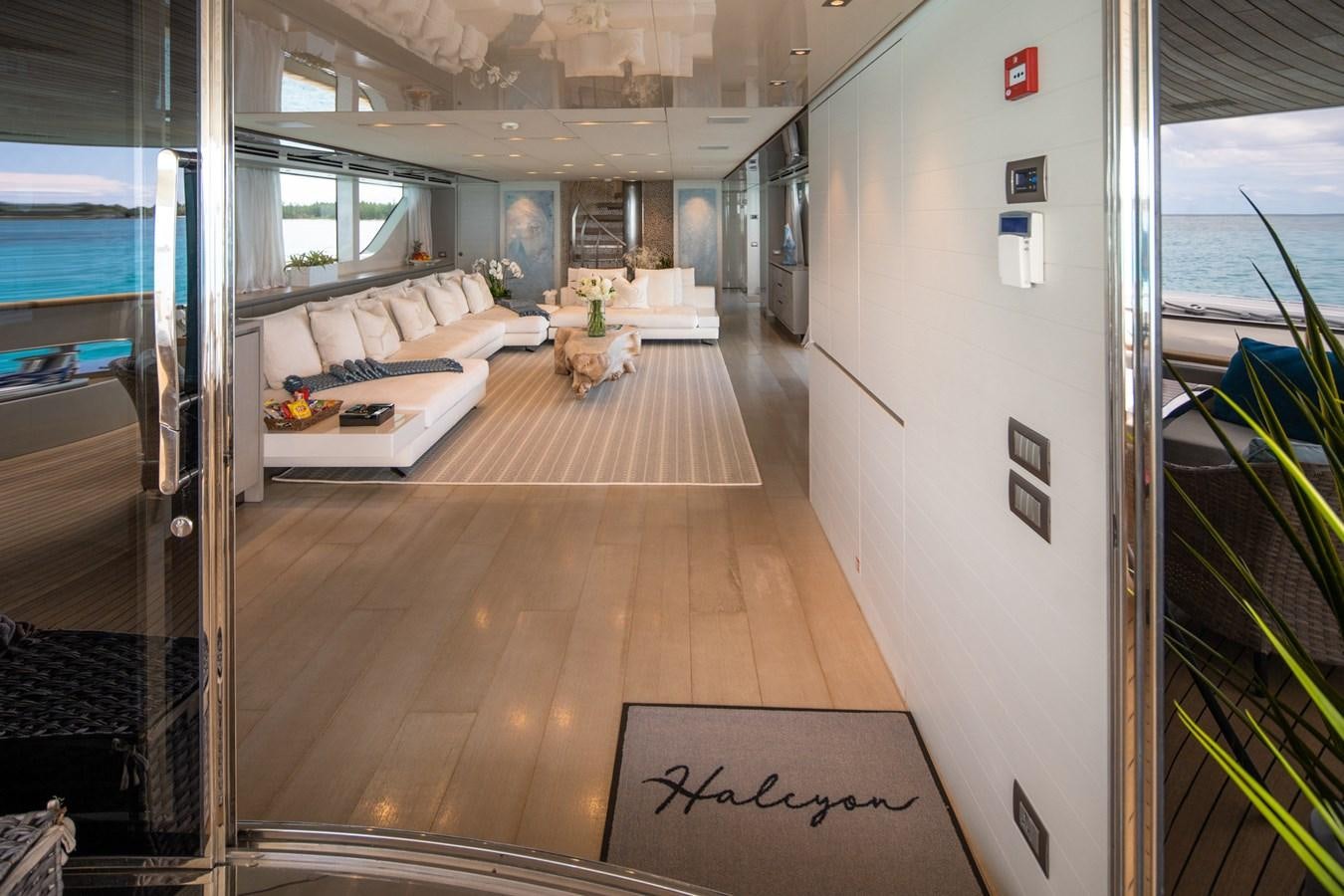 a room with a couch and a table aboard HALCYON Yacht for Sale