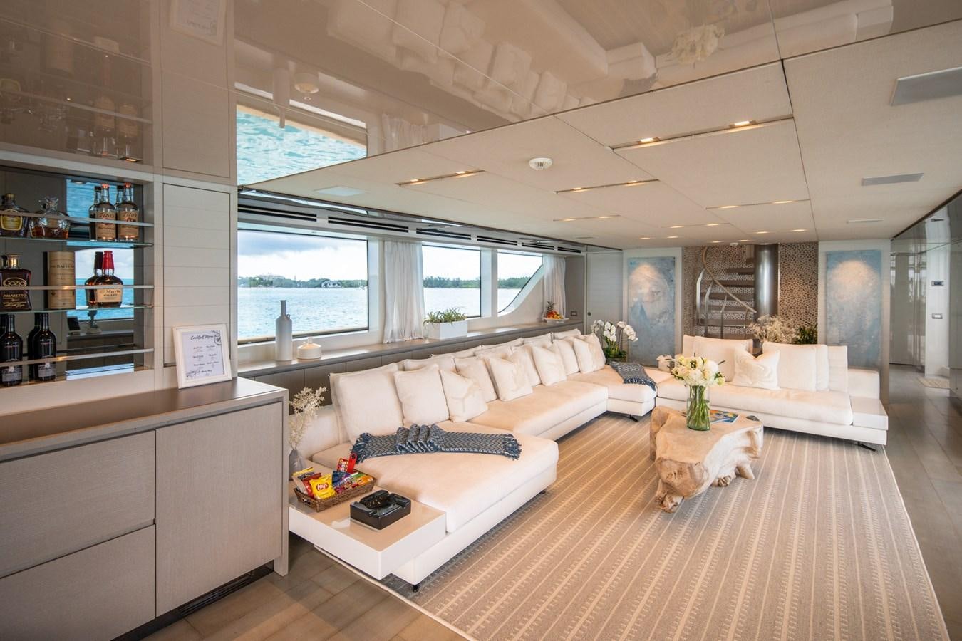 a living room with a large window aboard HALCYON Yacht for Sale