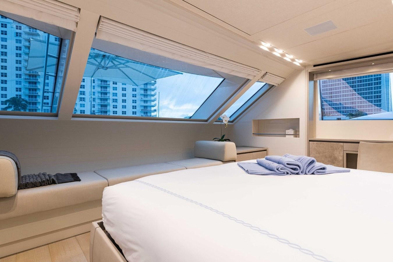 a room with a bed and a window aboard HALCYON Yacht for Sale