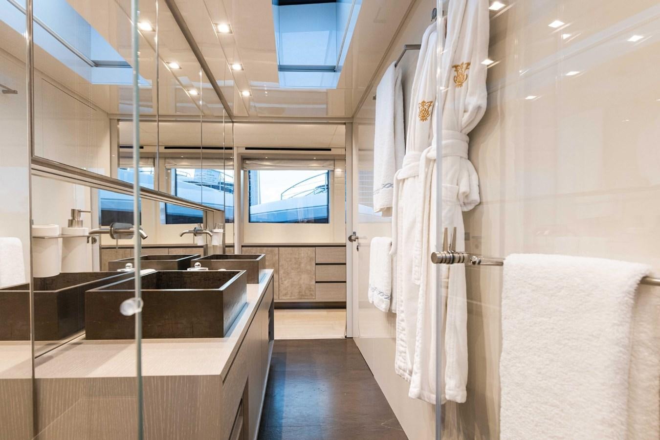a room with a large display of clothes on a rack aboard HALCYON Yacht for Sale