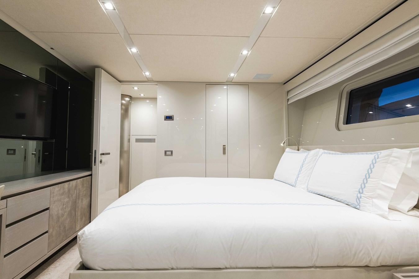 a white bed in a room aboard HALCYON Yacht for Sale