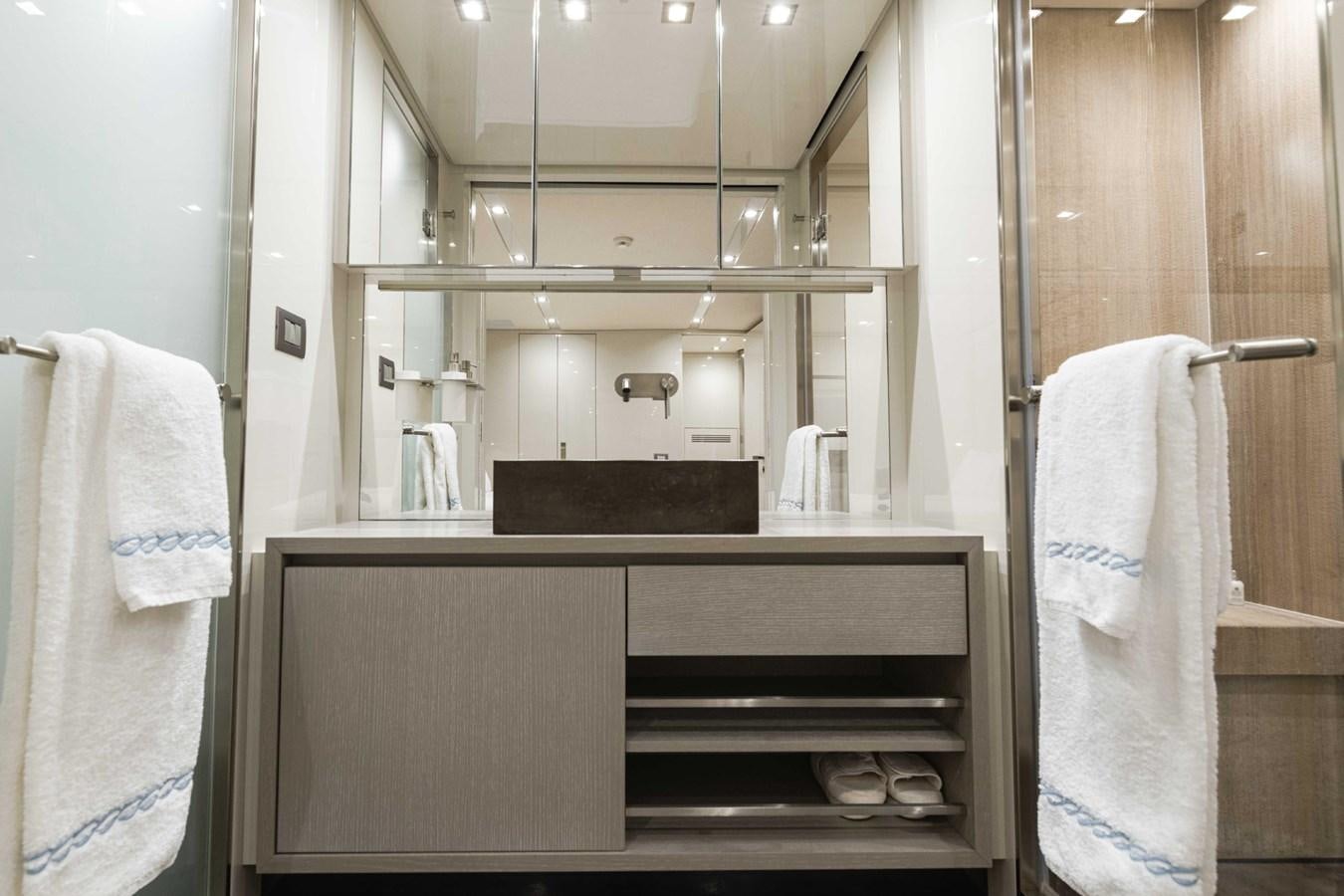 a bathroom with a sink and a mirror aboard HALCYON Yacht for Sale