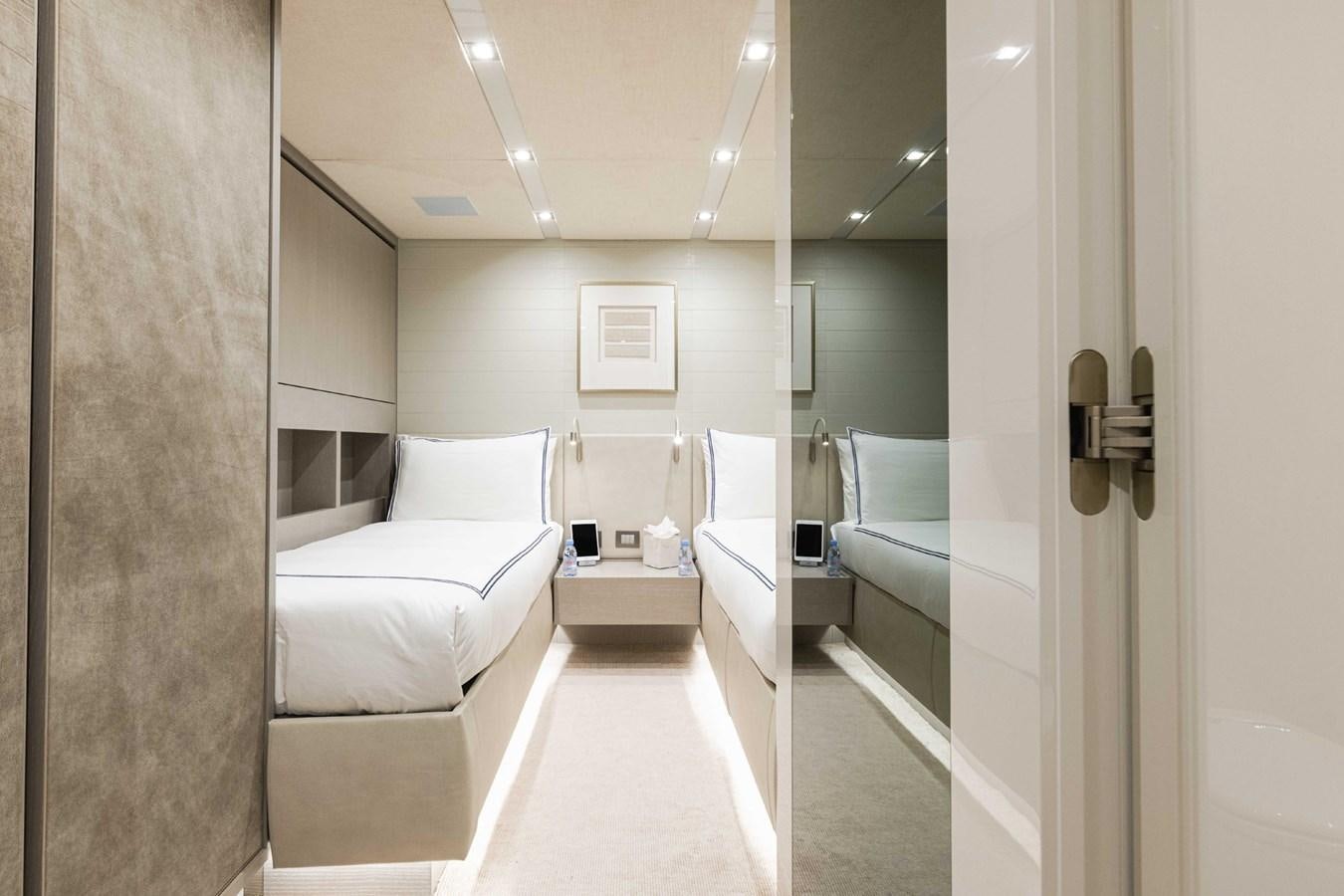 a room with a bed and a mirror aboard HALCYON Yacht for Sale