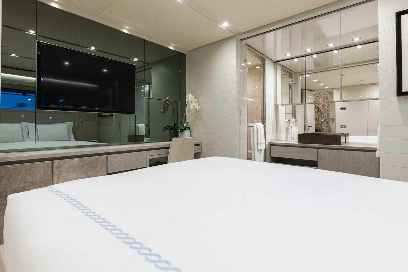 a large white bed in a room aboard HALCYON Yacht for Sale