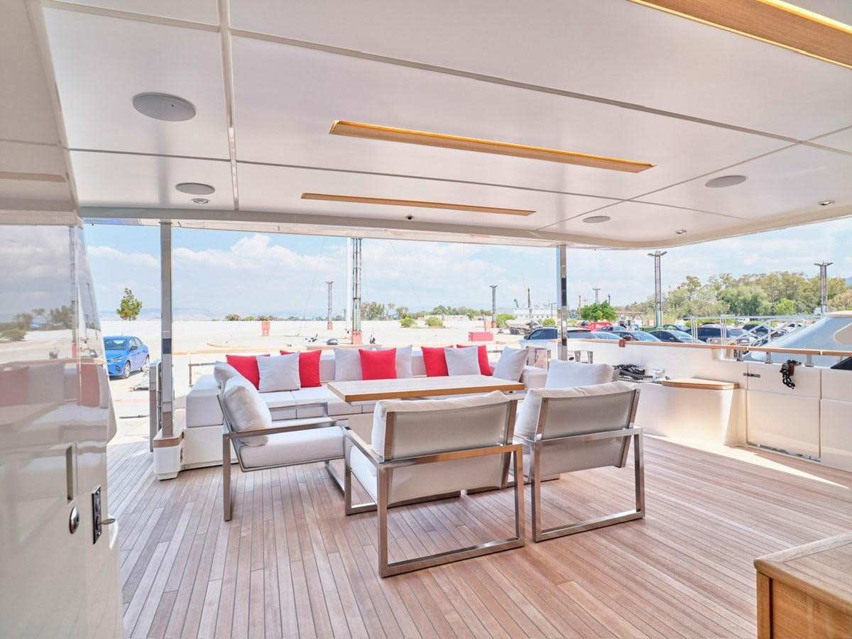 a room with a table chairs and a view of the water aboard "THIRTY SEVEN Yacht for Sale