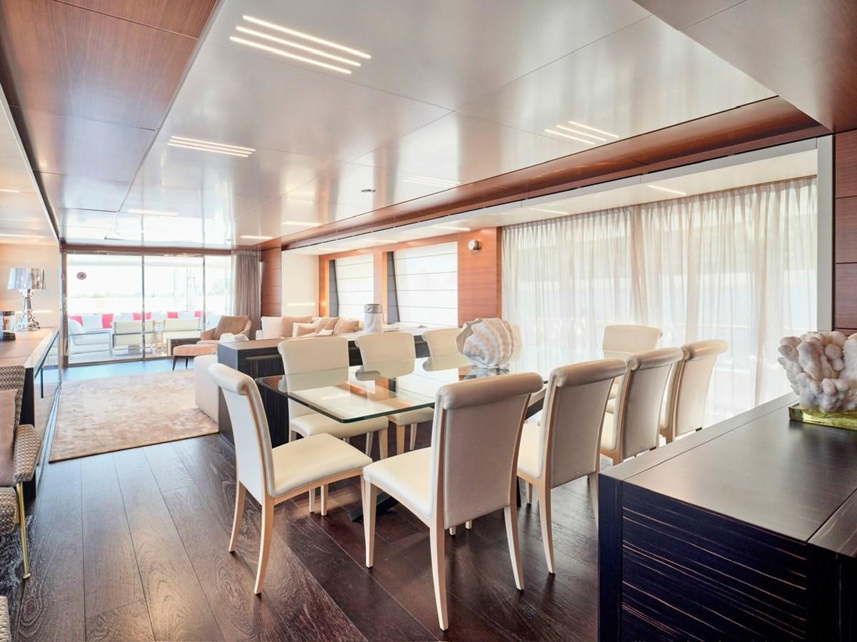 a room with tables and chairs aboard "THIRTY SEVEN Yacht for Sale