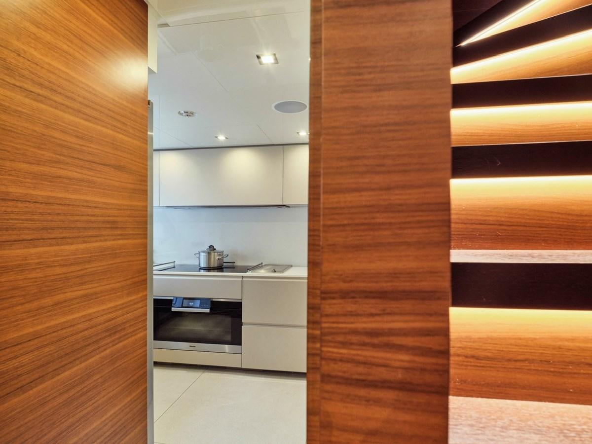a wooden closet with a stove and oven aboard "THIRTY SEVEN Yacht for Sale