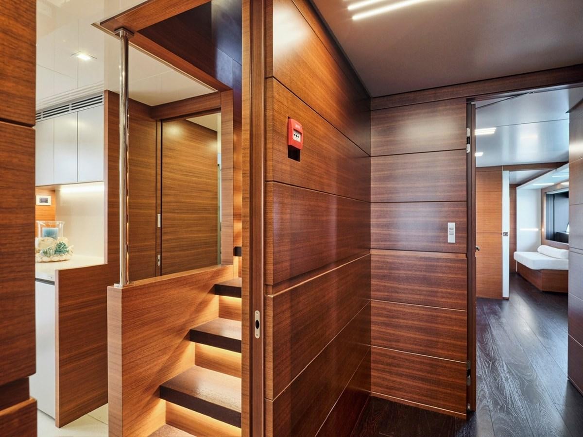 a room with wooden walls and wooden stairs aboard "THIRTY SEVEN Yacht for Sale