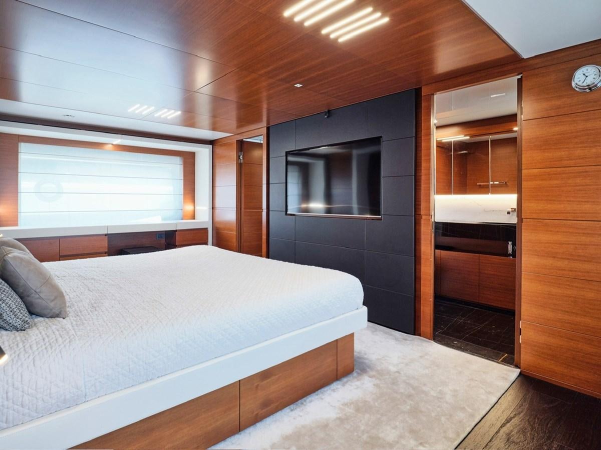 a bedroom with a bed and a closet aboard "THIRTY SEVEN Yacht for Sale