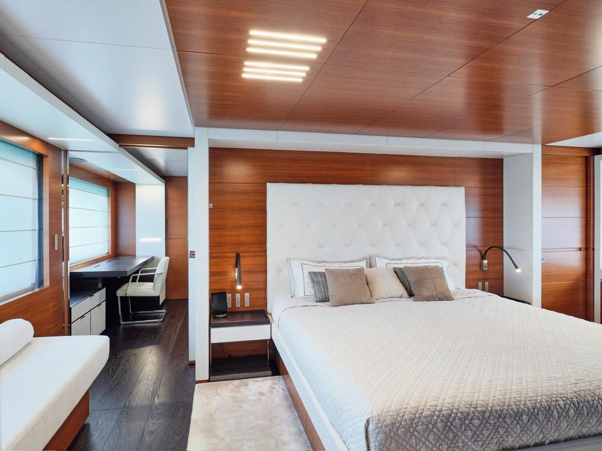 a bedroom with a bed and desk aboard "THIRTY SEVEN Yacht for Sale