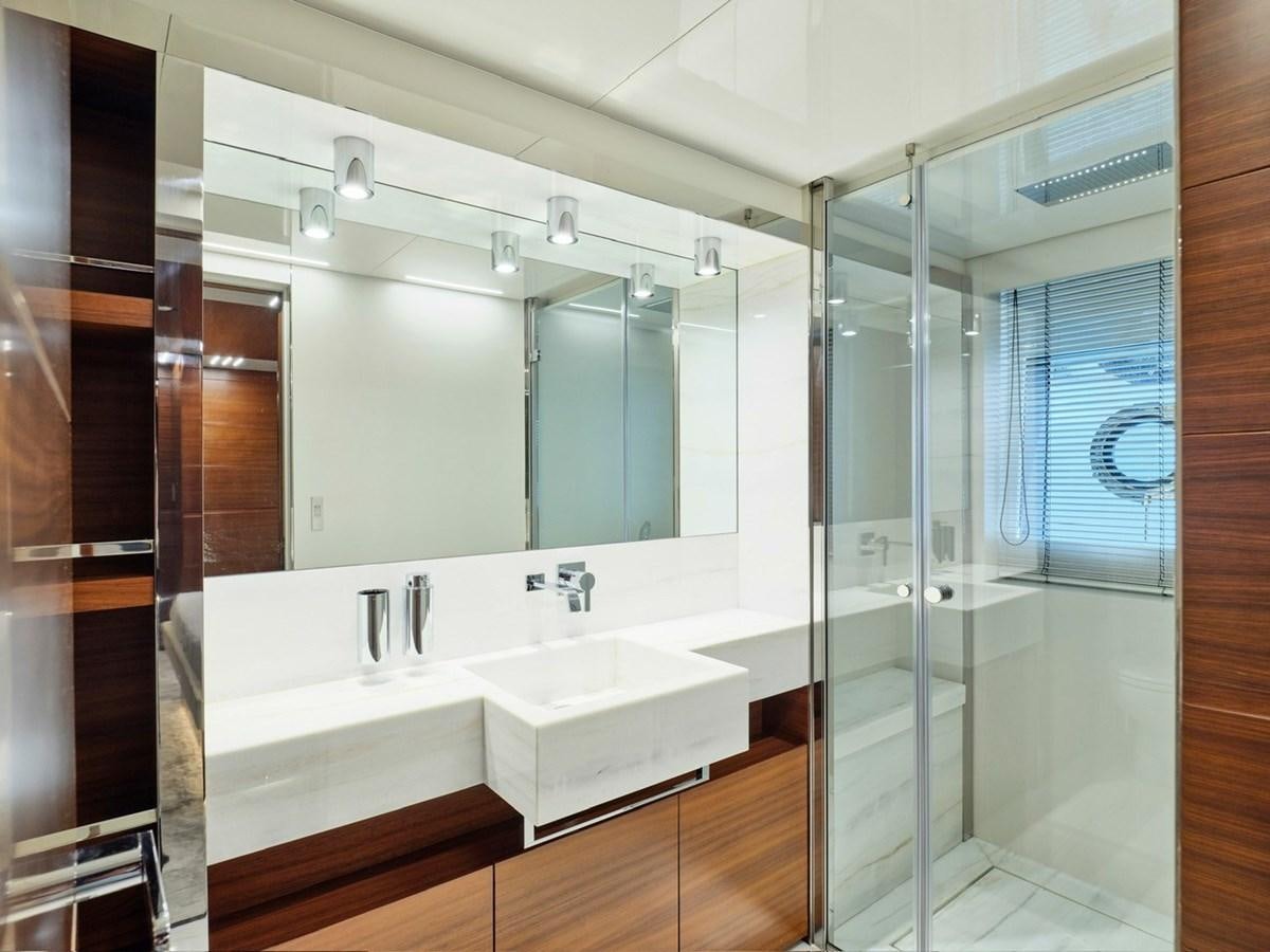 a bathroom with a large mirror aboard "THIRTY SEVEN Yacht for Sale