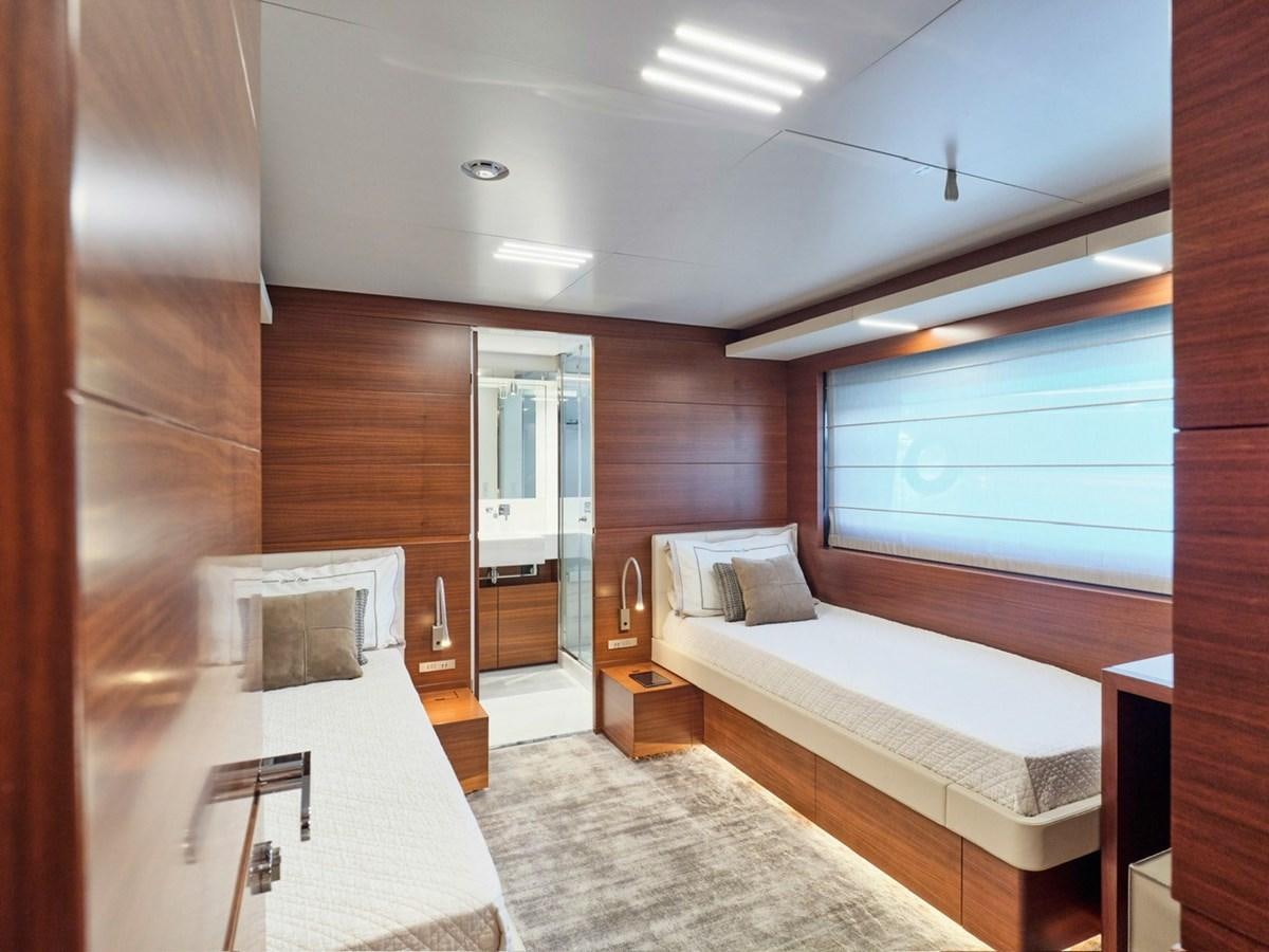 a room with a bed and a desk aboard "THIRTY SEVEN Yacht for Sale