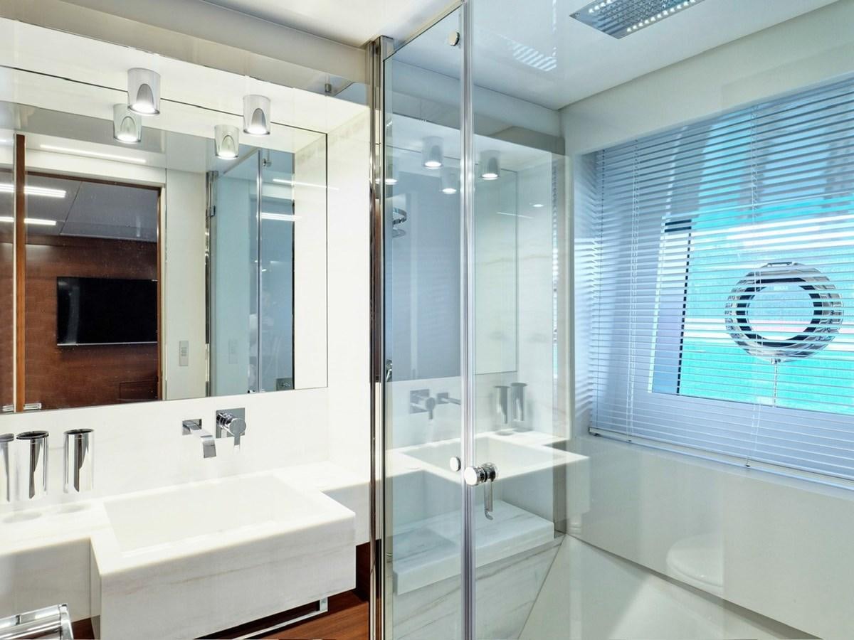 a bathroom with a large mirror aboard "THIRTY SEVEN Yacht for Sale