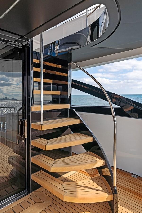 a room with a large window and a view of a city aboard LADY K Yacht for Sale