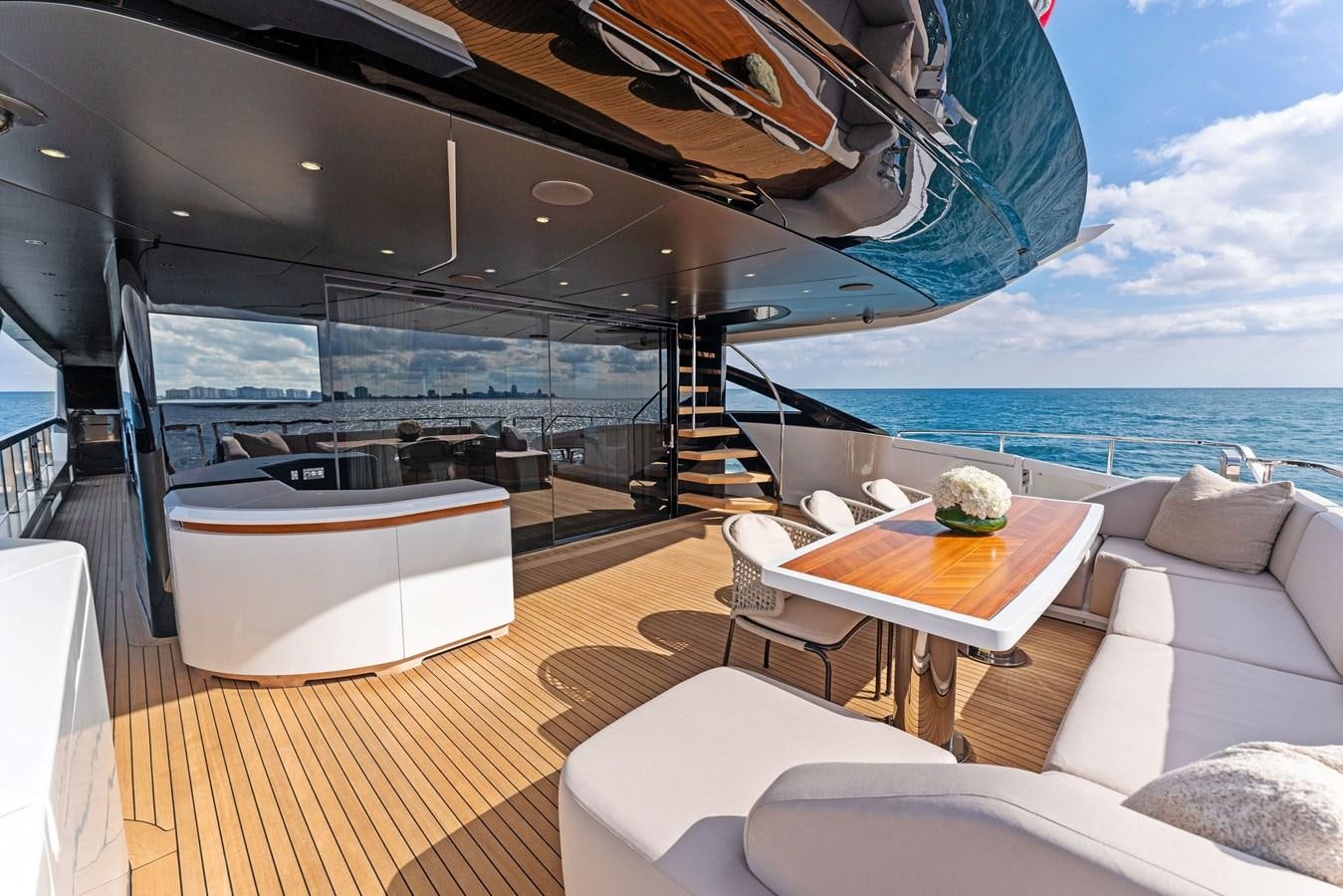 a room with a table and chairs aboard LADY K Yacht for Sale