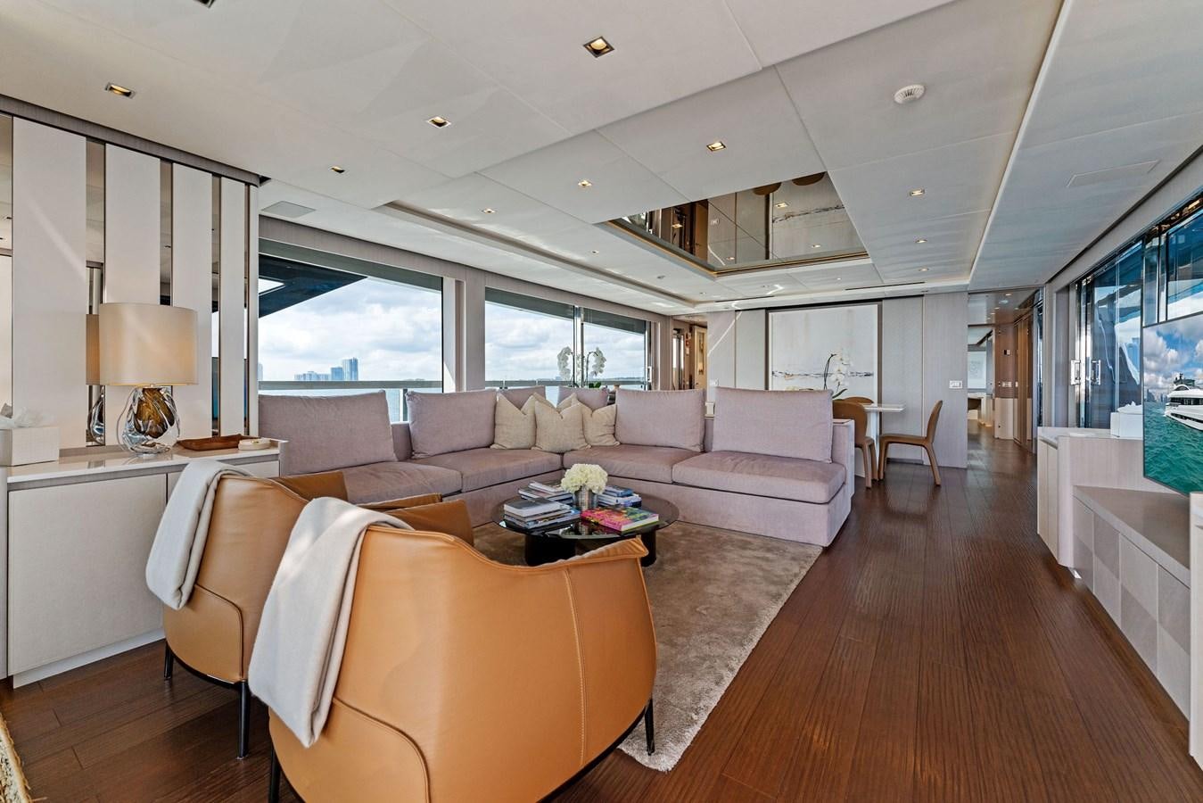 a living room with a large window aboard LADY K Yacht for Sale