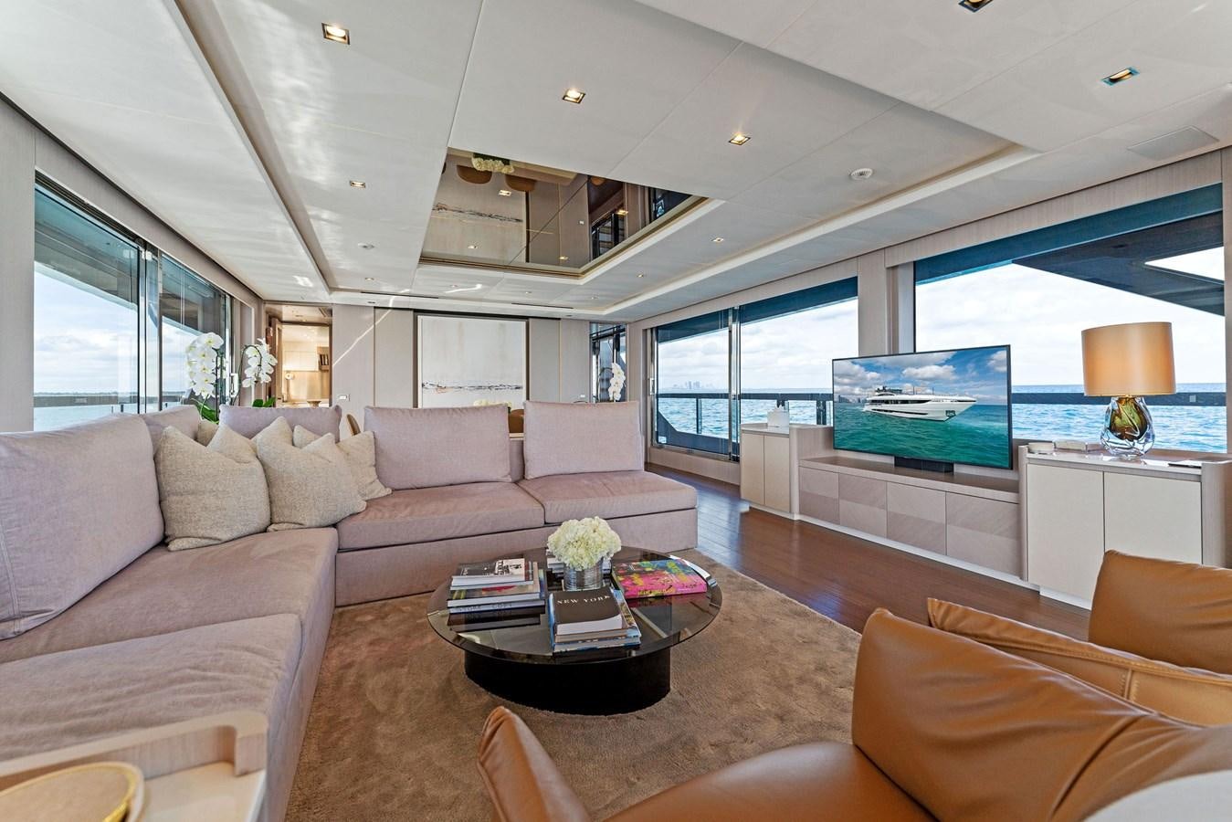 a living room with a large window aboard LADY K Yacht for Sale