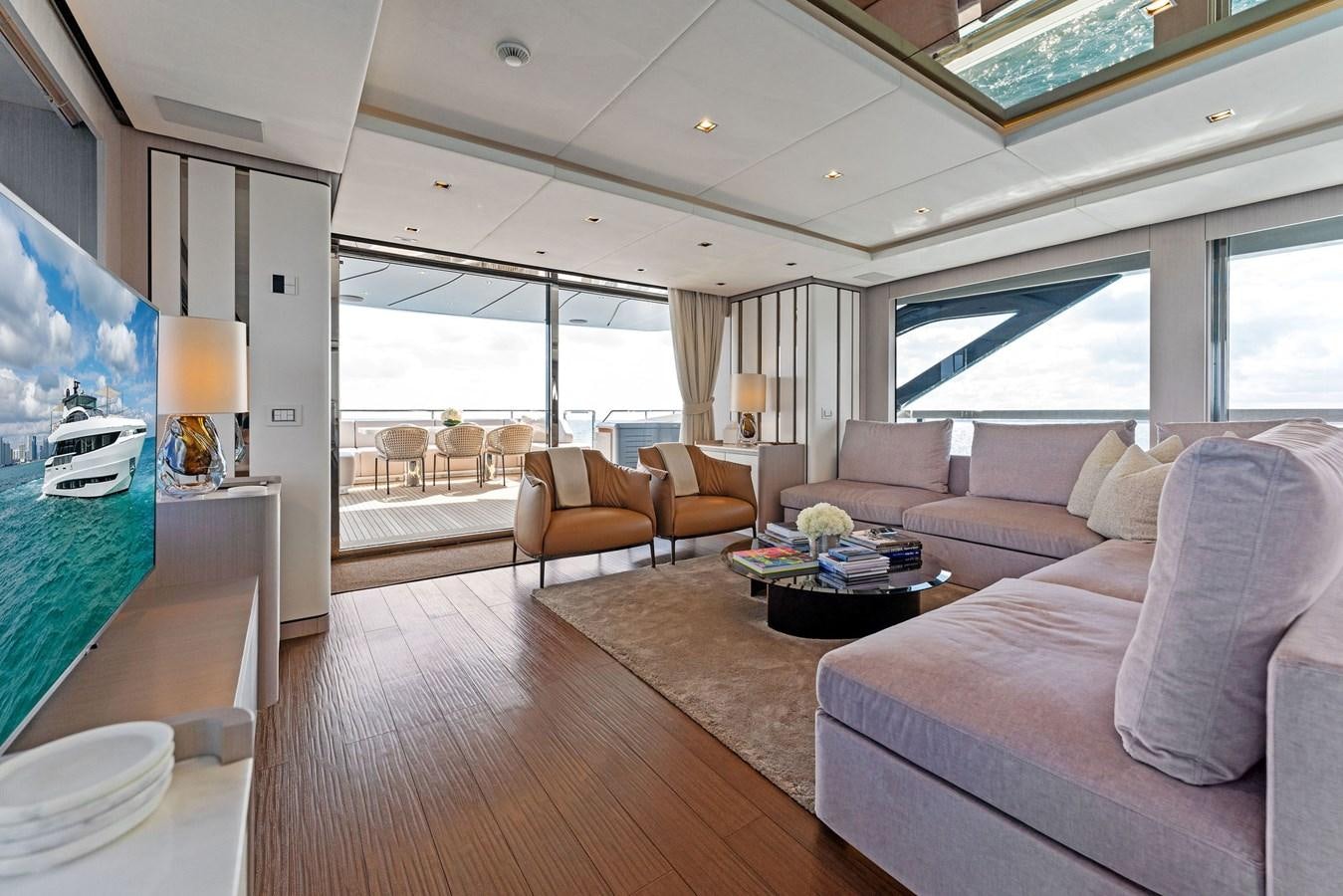 a living room with a large window aboard LADY K Yacht for Sale