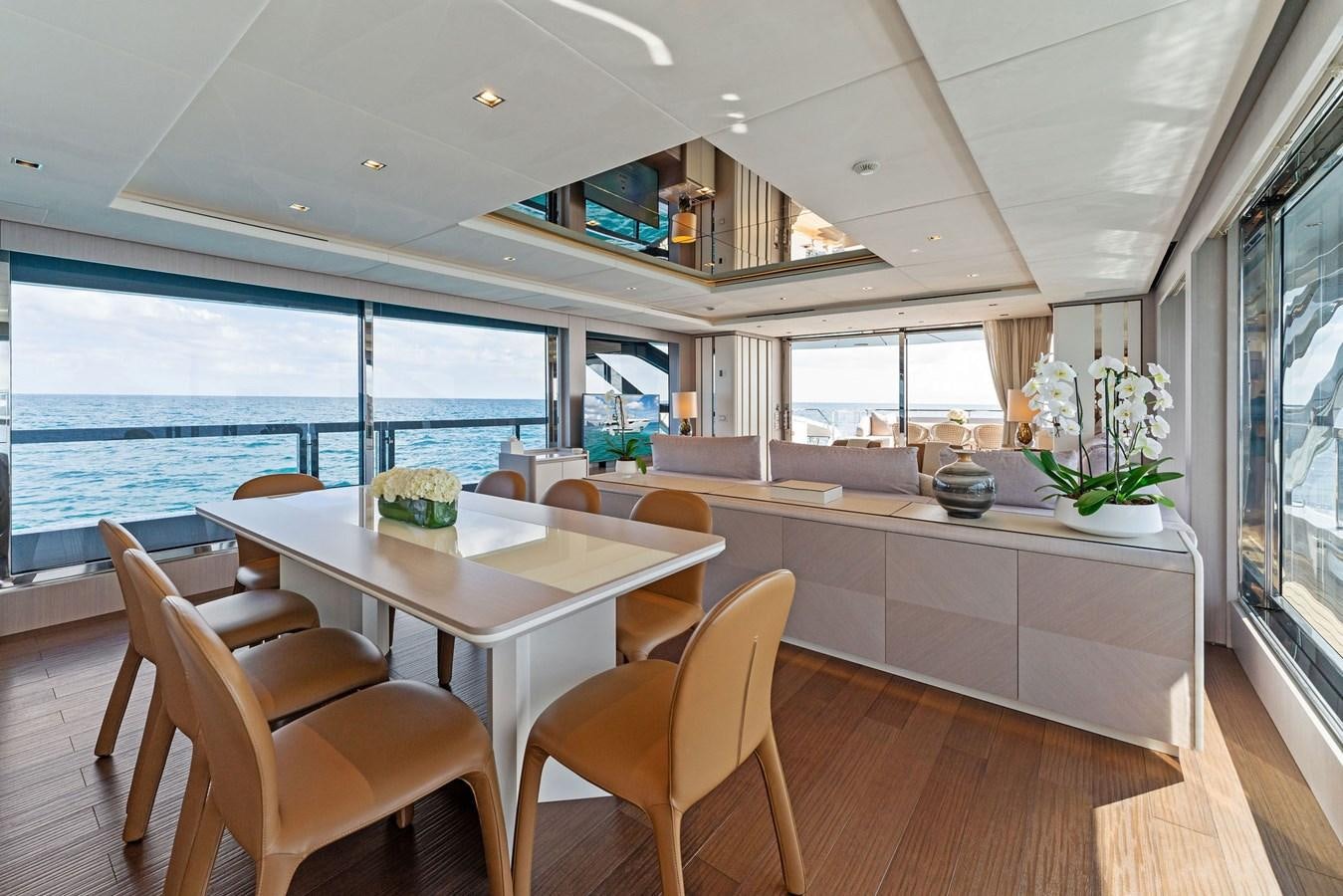 a kitchen with a table and chairs aboard LADY K Yacht for Sale