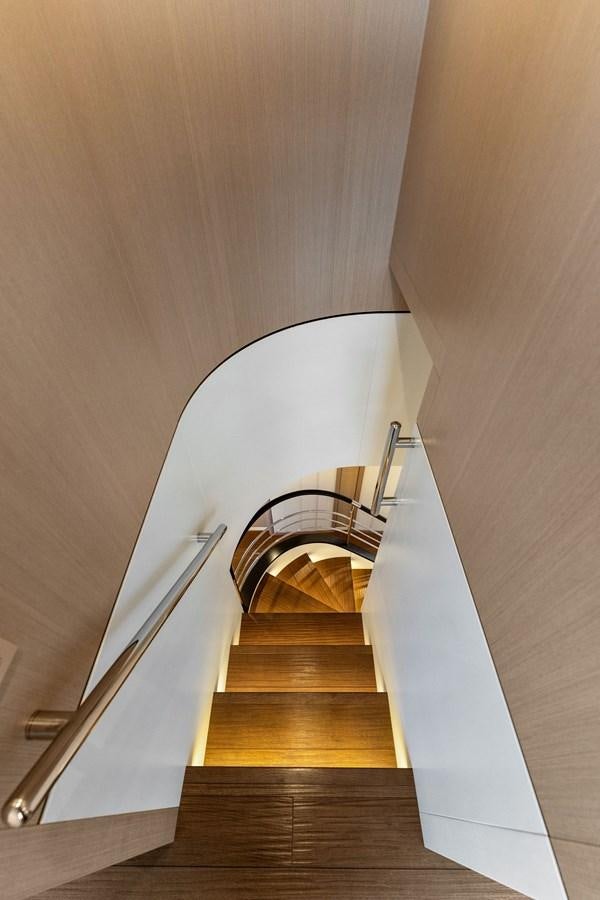 a staircase with a metal railing aboard LADY K Yacht for Sale