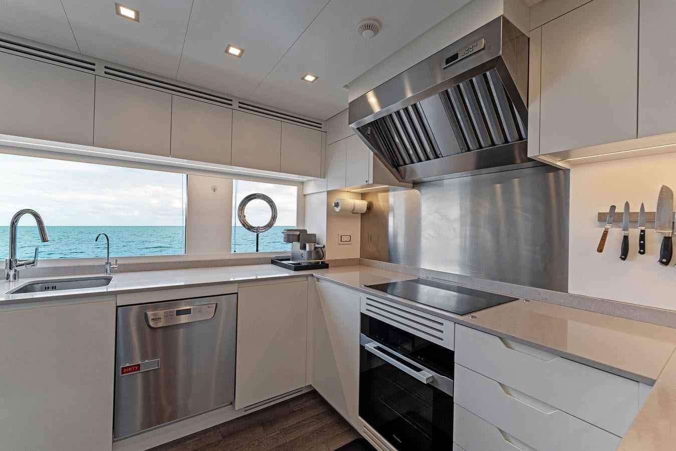 a kitchen with stainless steel appliances aboard LADY K Yacht for Sale