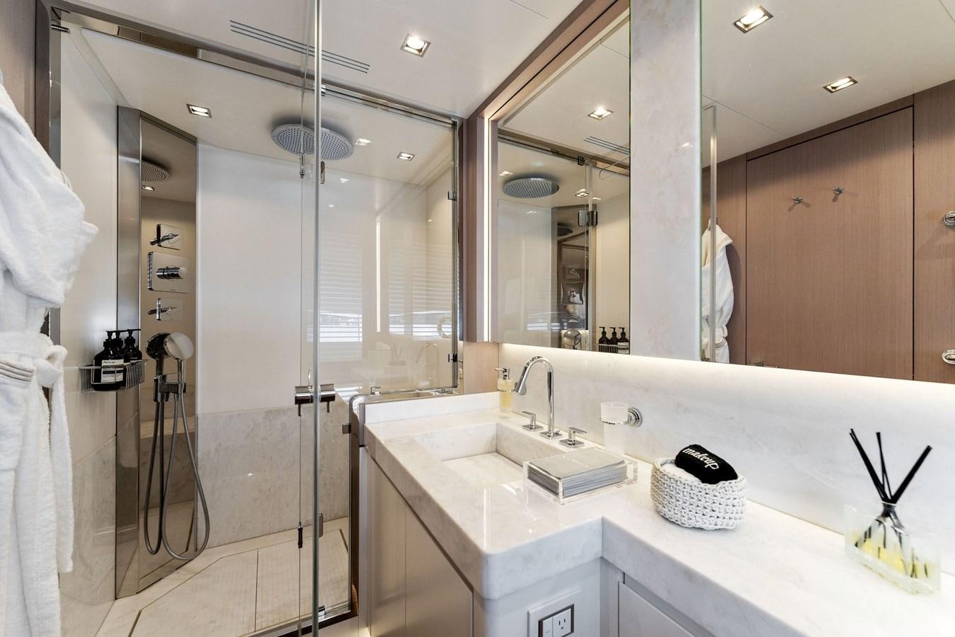 a bathroom with a large mirror aboard LADY K Yacht for Sale