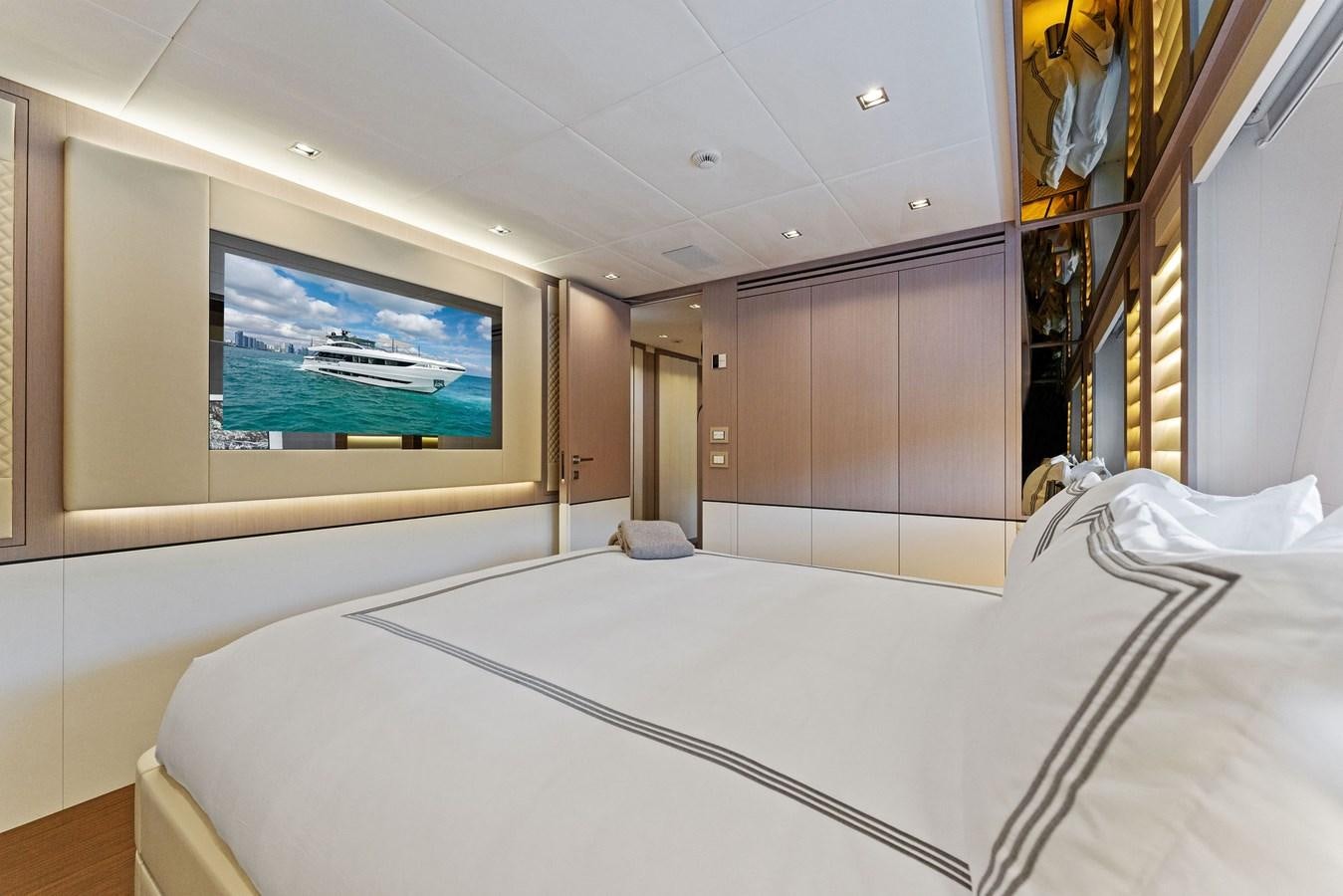 a room with a bed and a tv aboard LADY K Yacht for Sale