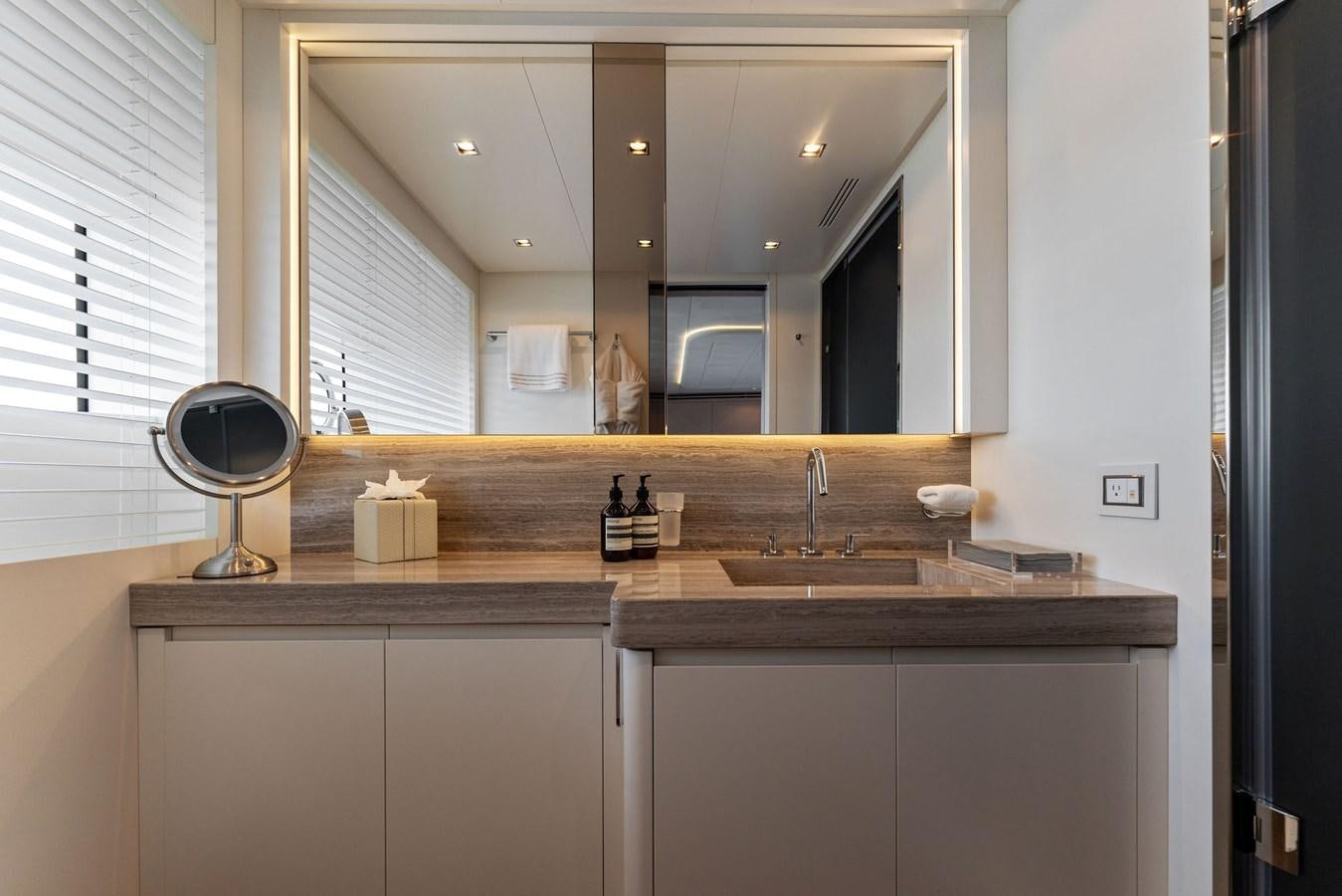 a bathroom with a large mirror aboard LADY K Yacht for Sale