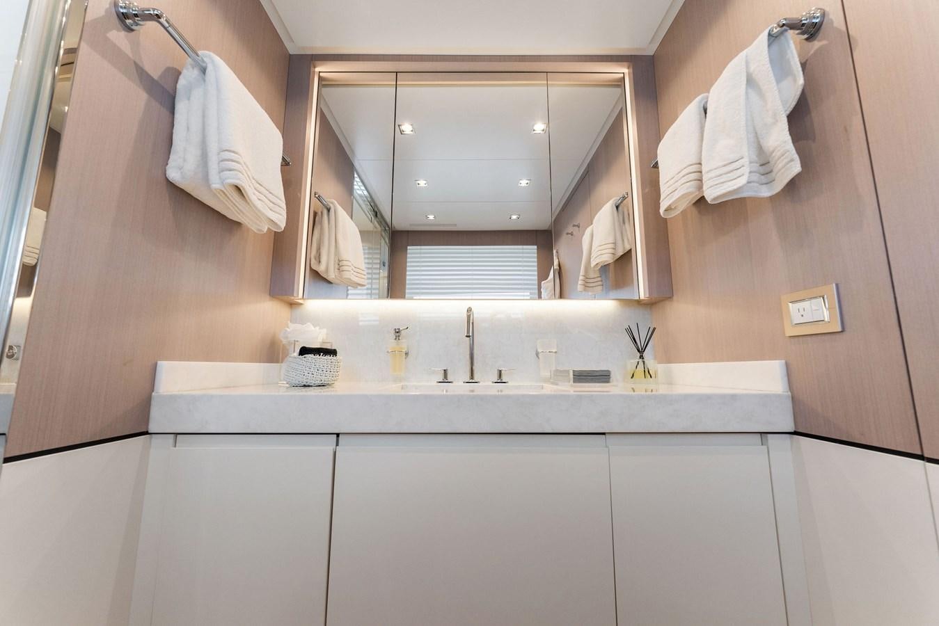 a bathroom with a large mirror aboard LADY K Yacht for Sale