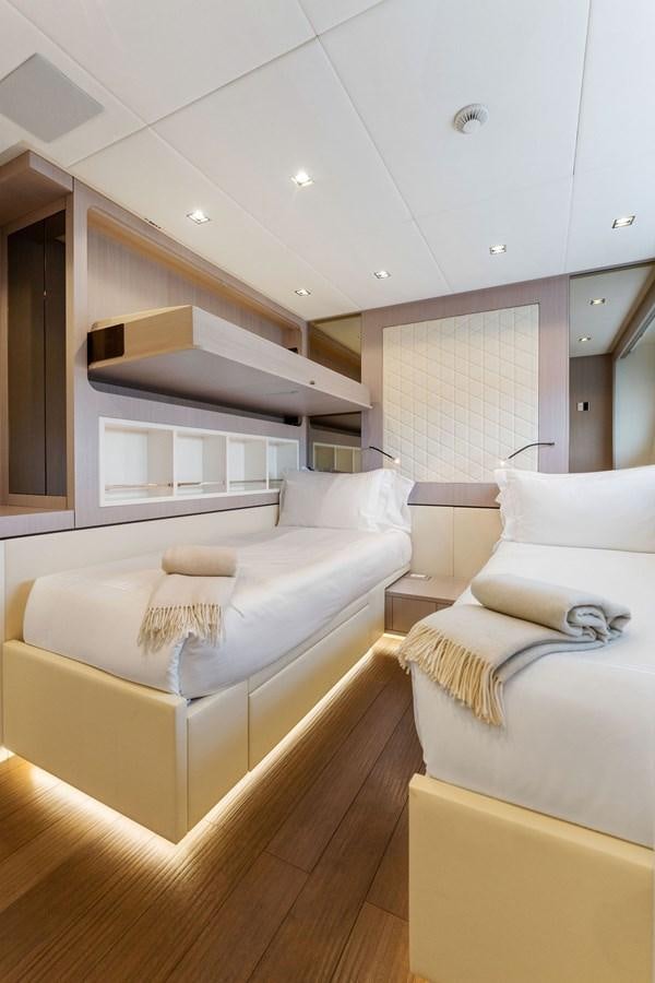 a room with two beds aboard LADY K Yacht for Sale
